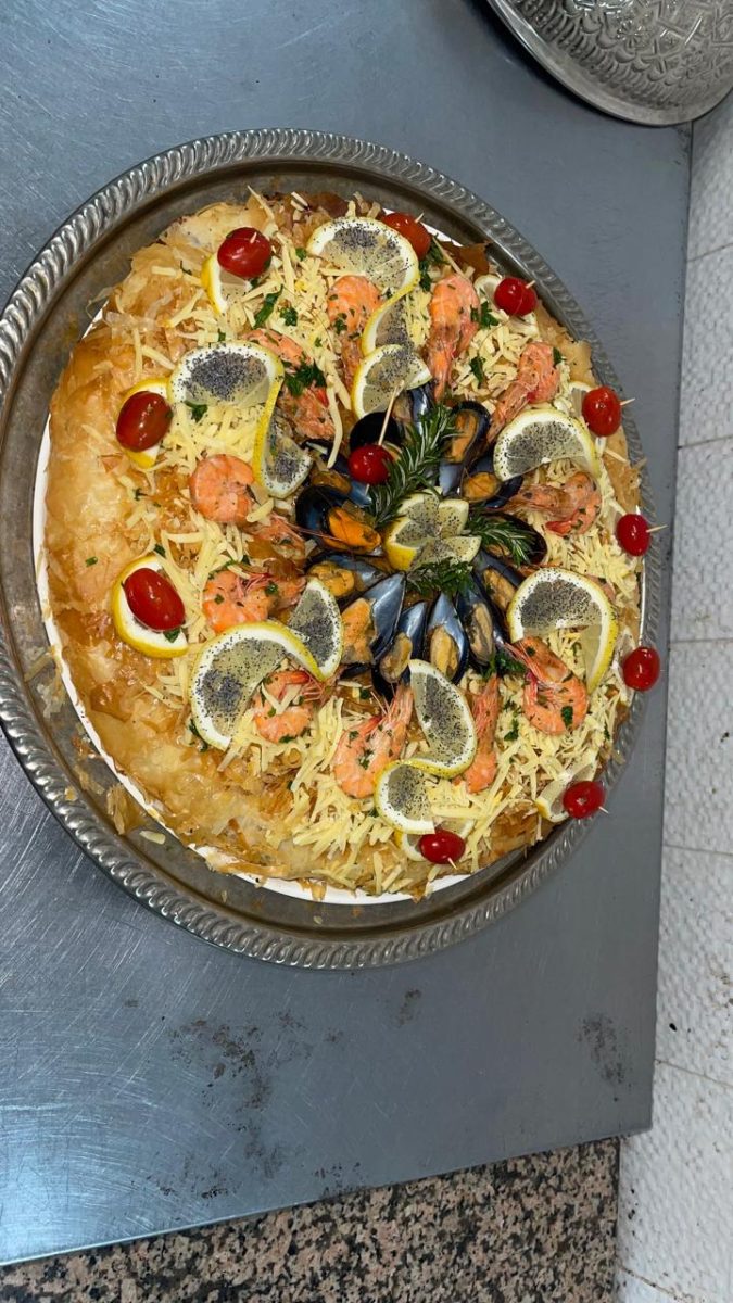 Pastilla aux fruits de mer au fromage râpé