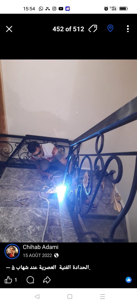 Soudure d'un garde-corps d'escalier en fer forgé