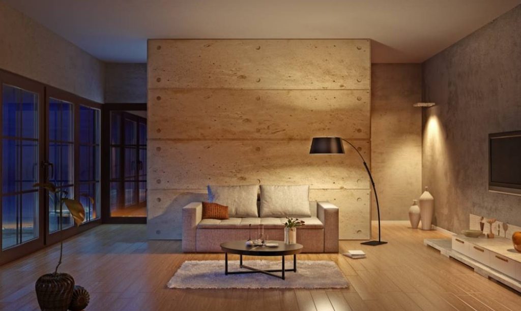 Séjour à mur en béton cire à plots et lampadaire arc