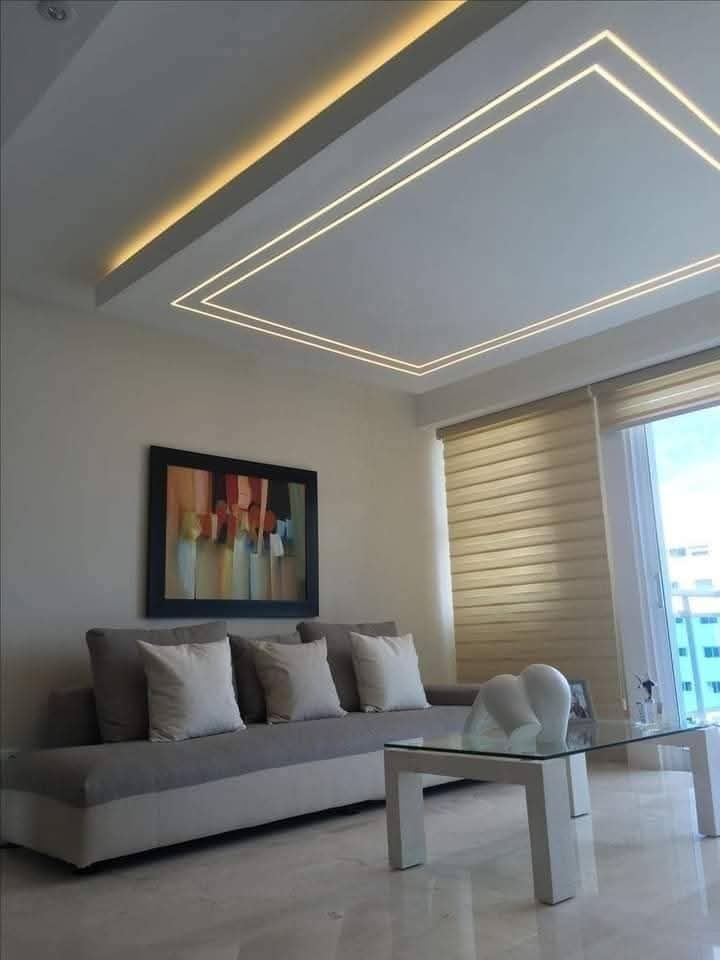 Salon avec faux plafond en plâtre à double cadre lumineux LED
