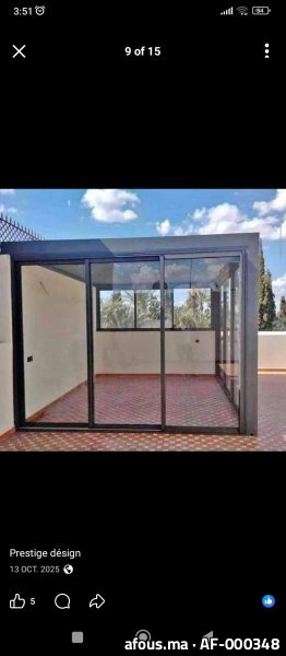 Véranda en aluminium gris sur toiture-terrasse